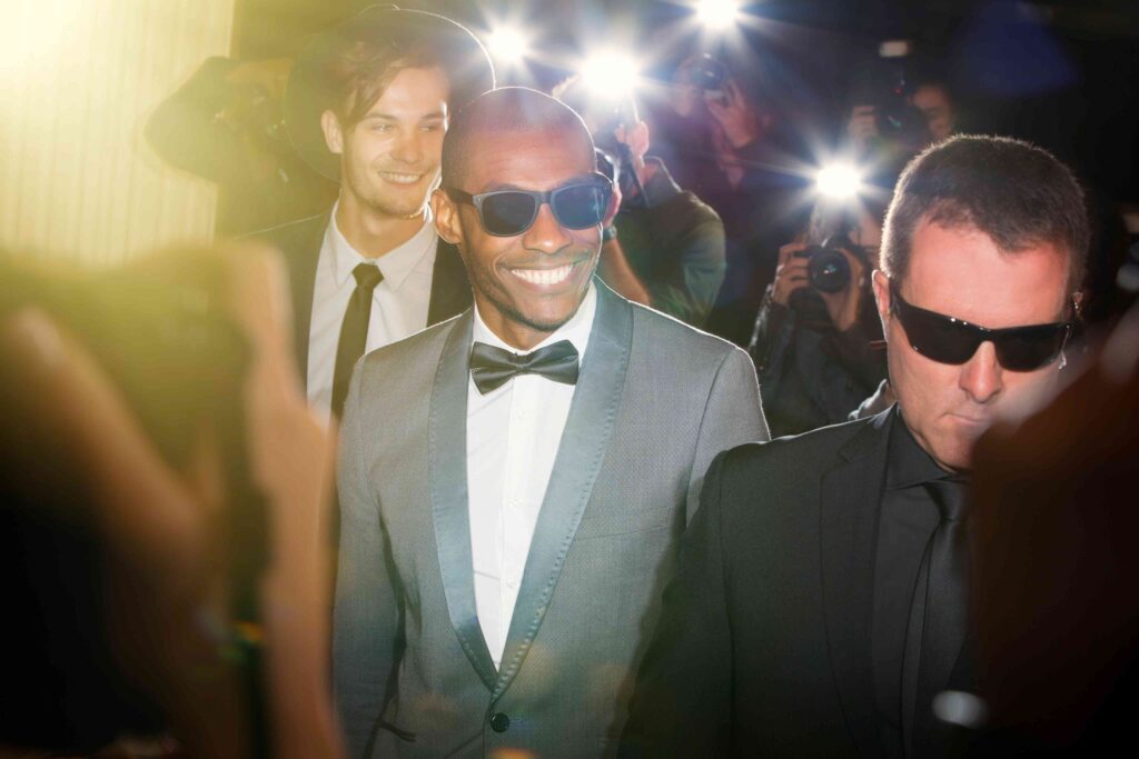 Man smiling at red carpet event