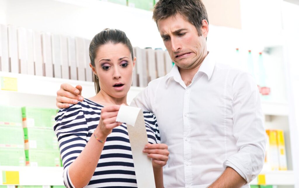 A couple surprised at their shopping total