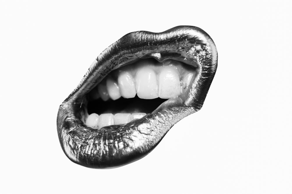 A black and white photo of a mouth